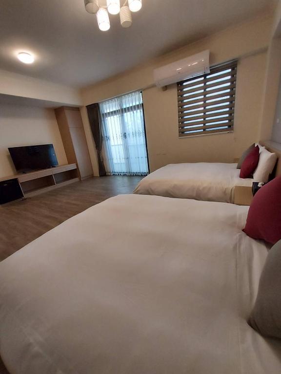 Postel nebo postele na pokoji v ubytování Miss Travel Homestay