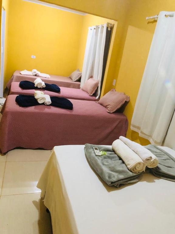 Uma cama ou camas num quarto em Pousada Voadores Jalapão