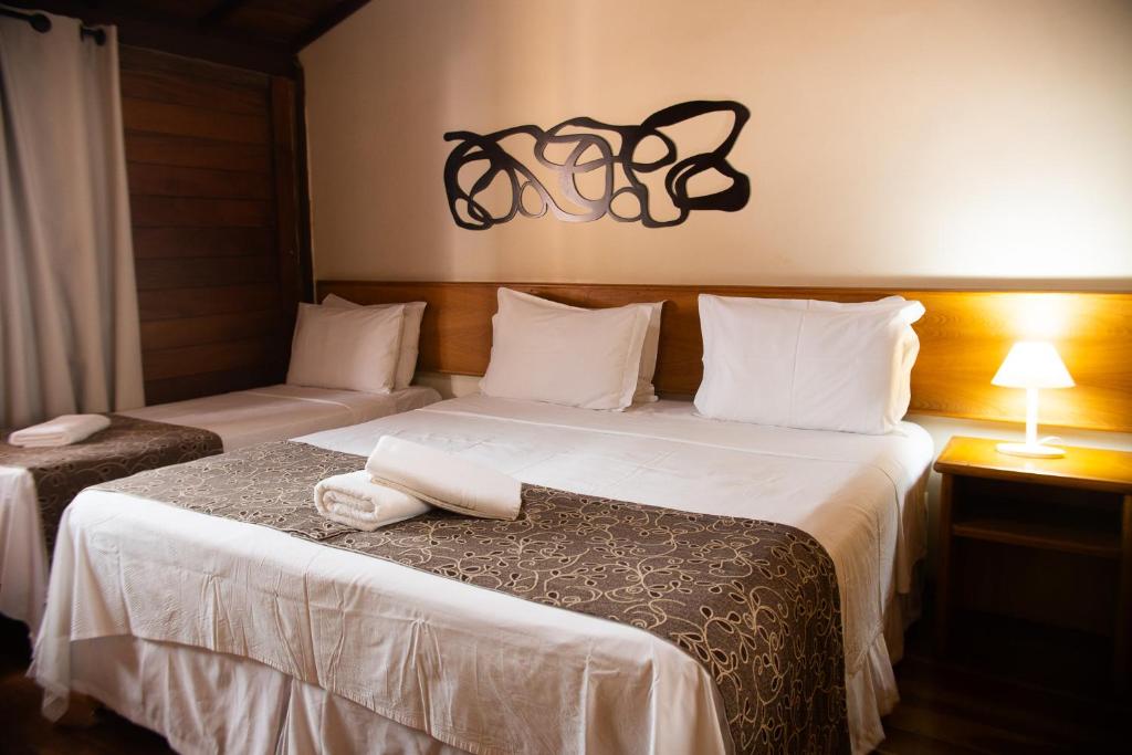 Säng eller sängar i ett rum på Dunas de Itaipu