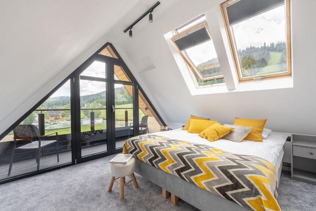 Posteľ alebo postele v izbe v ubytovaní STACJA NOSAL Apartamenty