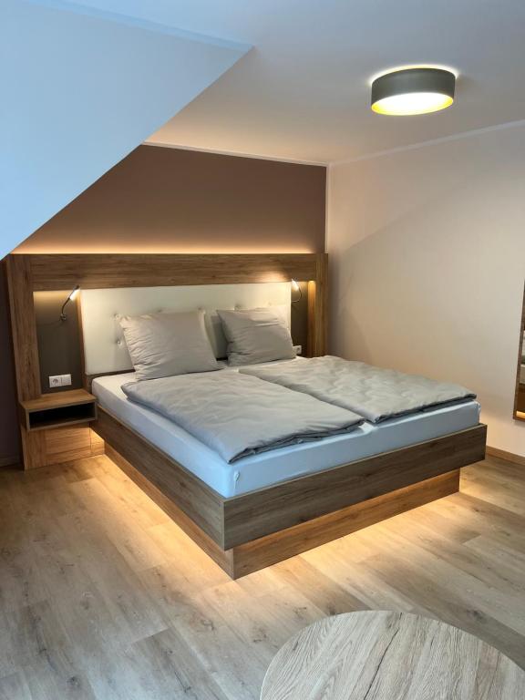 a bedroom with a large bed in a room at Hotel Preyt -Self Check In- in Holtlander Nücke