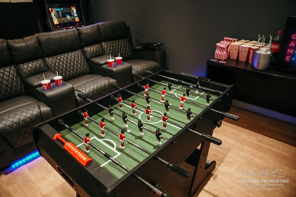 a foosball game on a table in a living room at Princes st by Prestige Properties SA in Ulverston