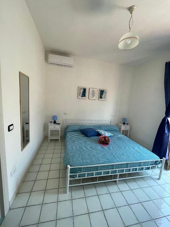 Postel nebo postele na pokoji v ubytování B&B Orizzonte Blu