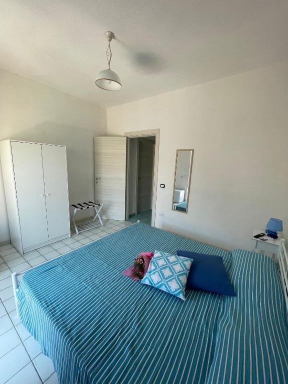 Postel nebo postele na pokoji v ubytování B&B Orizzonte Blu