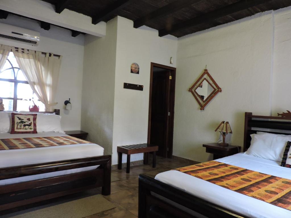 Postel nebo postele na pokoji v ubytování Hotel Puerto Gaviota