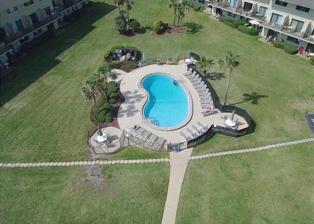 an aerial view of a swimming pool on a lawn at Summerhouse 104 in Saint Augustine