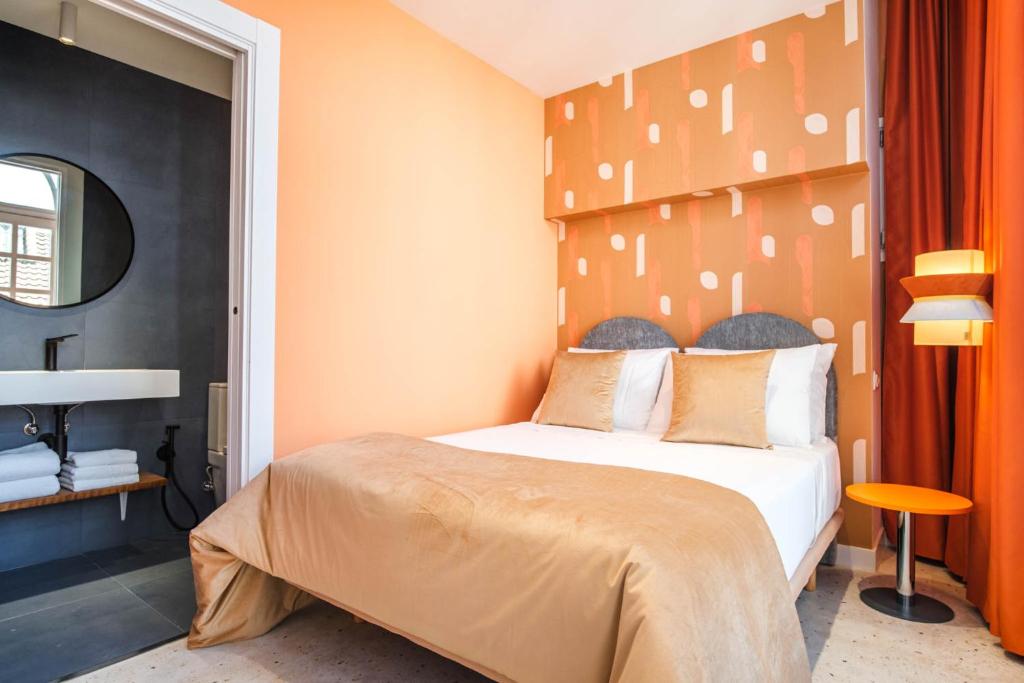 Postel nebo postele na pokoji v ubytování Apartamentos El Reloj