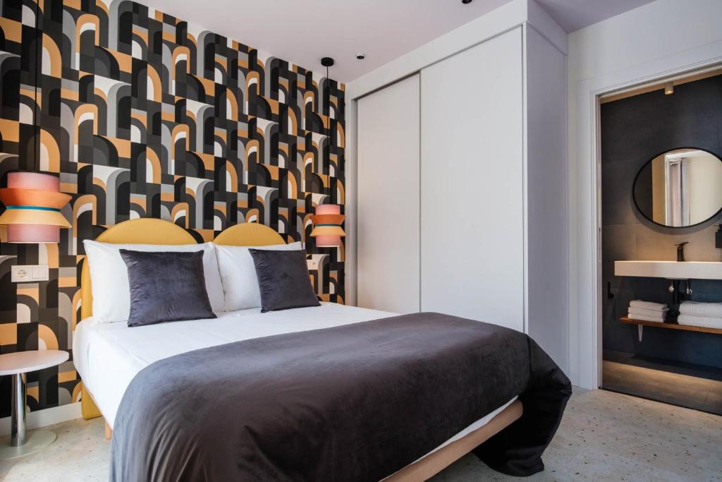 Postel nebo postele na pokoji v ubytování Apartamentos El Reloj