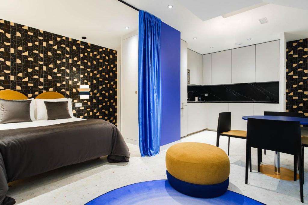 Postel nebo postele na pokoji v ubytování Apartamentos El Reloj