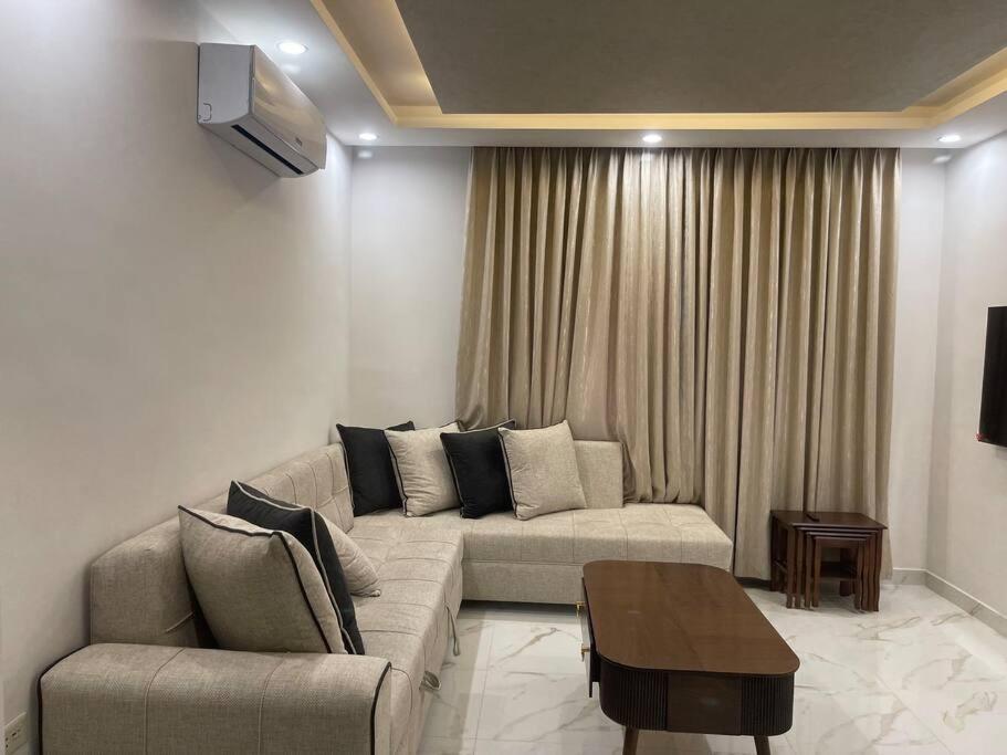 Posezení v ubytování Oqdeh Delux Apartments