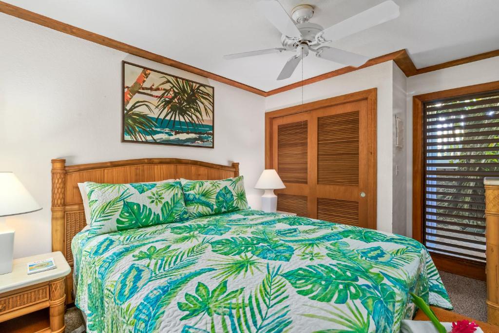 a bedroom with a bed and a ceiling fan at 1st Floor Kiahuna 1br Condo, Garden View, Athletic Club KP422 in Koloa