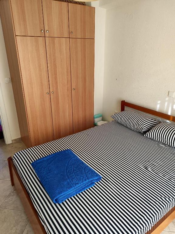 Postel nebo postele na pokoji v ubytování ΛΕΛΑ