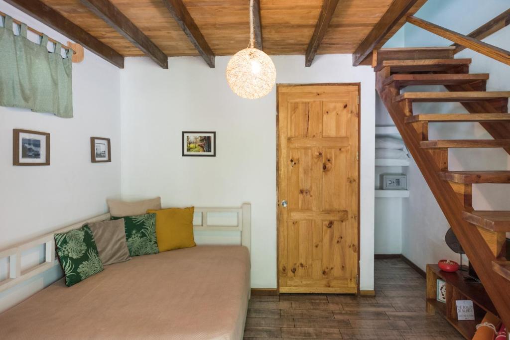 Кровать или кровати в номере Ohana Villas