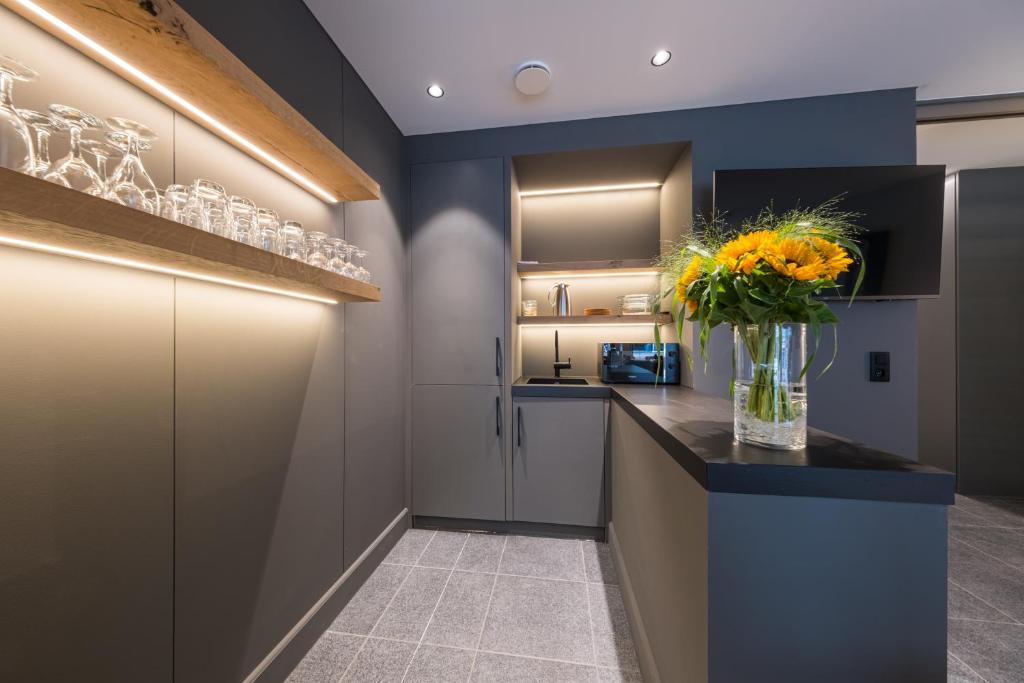 A cozinha ou kitchenette de Belcasa Suitehotel