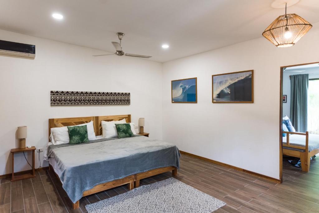 Кровать или кровати в номере Ohana Villas