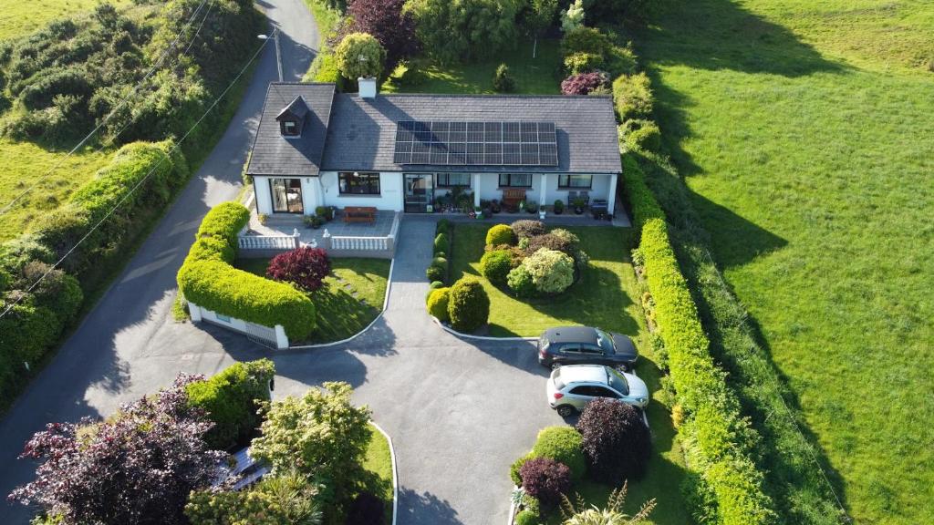 an aerial view of a house with a solar roof at Marguerite's B&B in Skibbereen