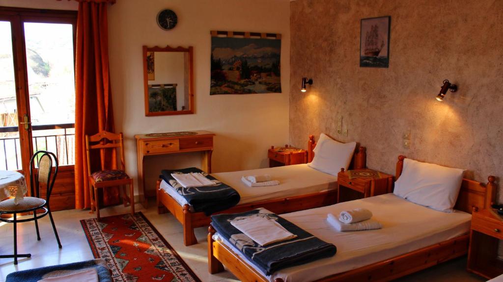Postel nebo postele na pokoji v ubytování Zozas Rooms