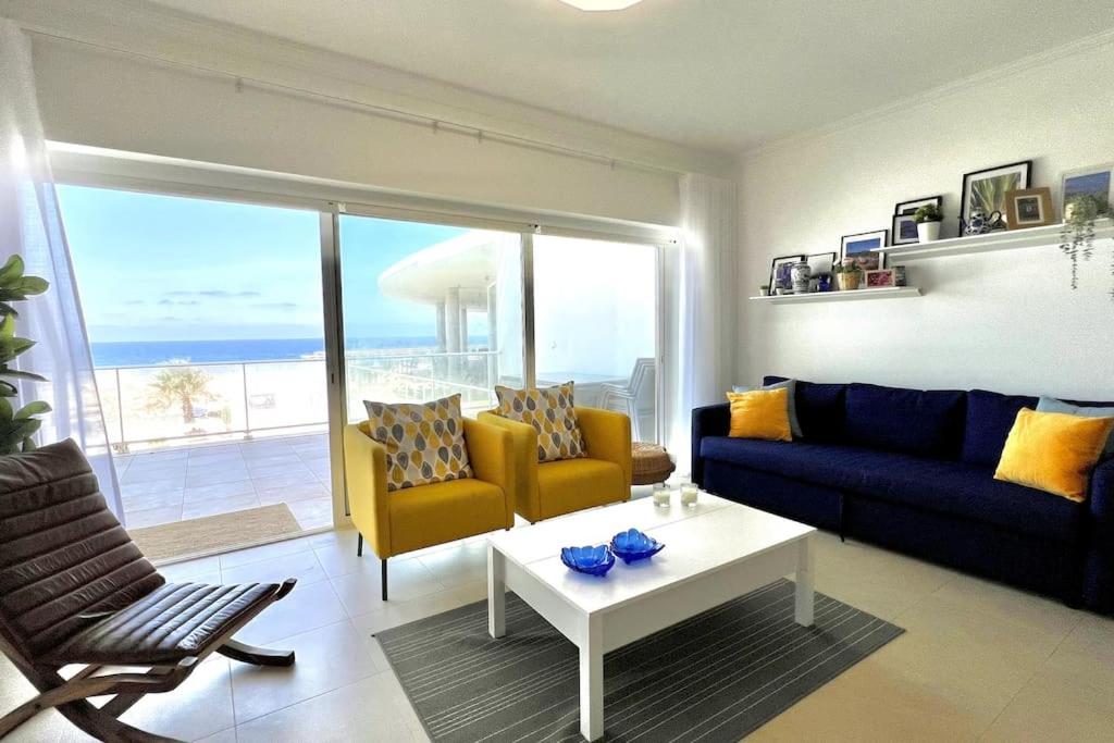 a living room with a couch and a table at Deluxe 2 Bedroom Flat - BeachFront - Praia Del Rey in Amoreira