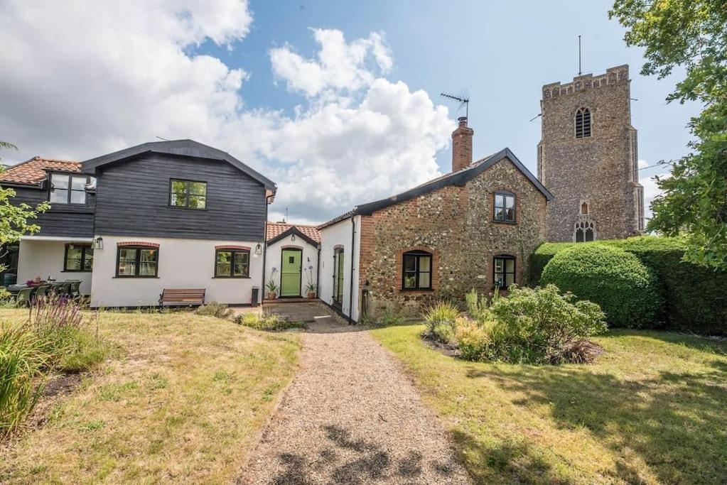 an exterior view of a house with a tower at The Old Forge, Great Glemham in Great Glemham