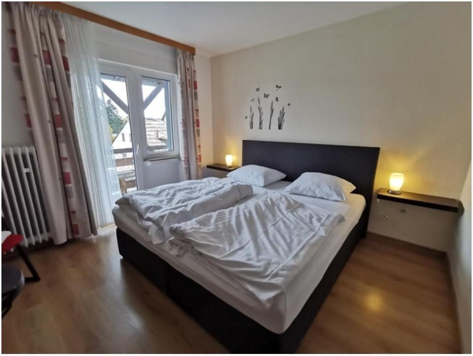Postel nebo postele na pokoji v ubytování Gasthaus Schürmann