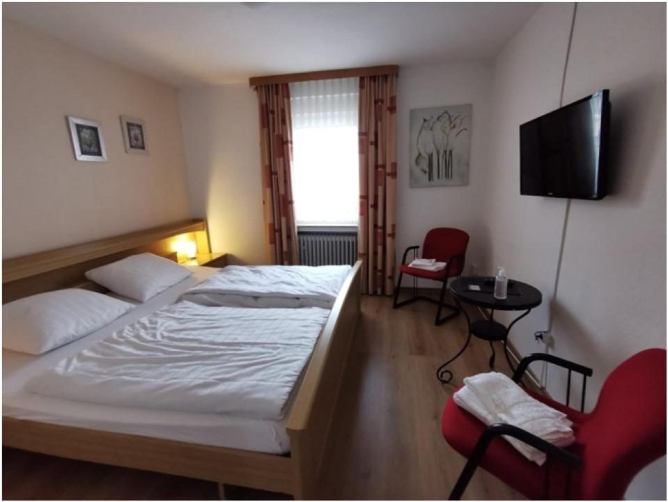 Postel nebo postele na pokoji v ubytování Gasthaus Schürmann