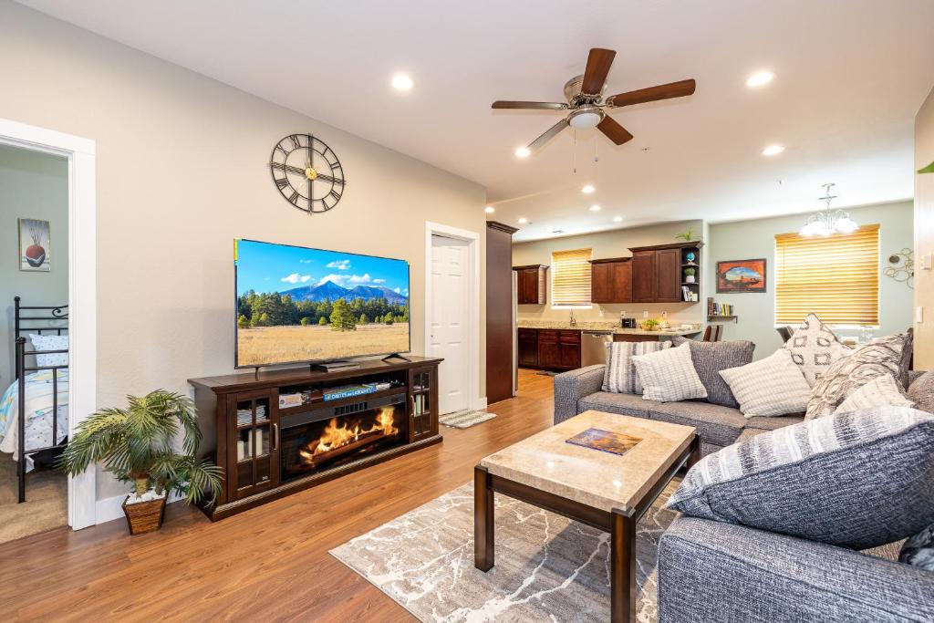 a living room with a couch and a fireplace at Luxury Home Downtown NAU Route 66 Snowbowl in Flagstaff