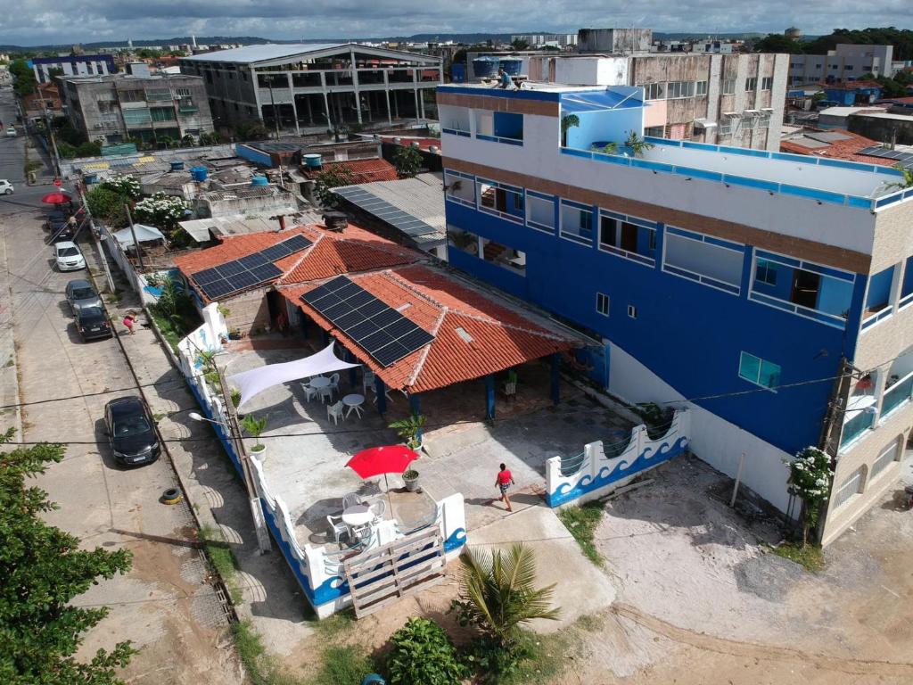 an overhead view of a building with solar panels on its roof at Pousada e Hotel Malibu in Paulista