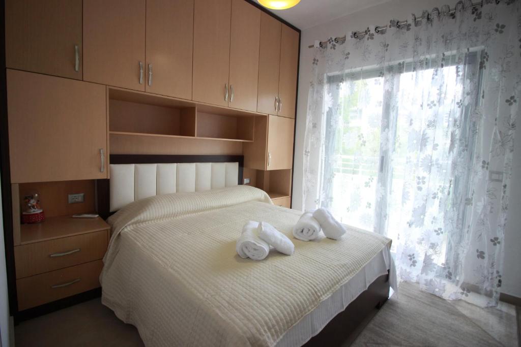 Postel nebo postele na pokoji v ubytování Muko's Apartments
