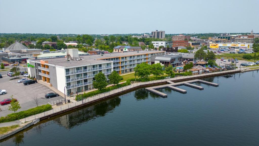an aerial view of a city with a bridge over a river at Holiday Inn Hotel Peterborough Waterfront, an IHG Hotel in Peterborough