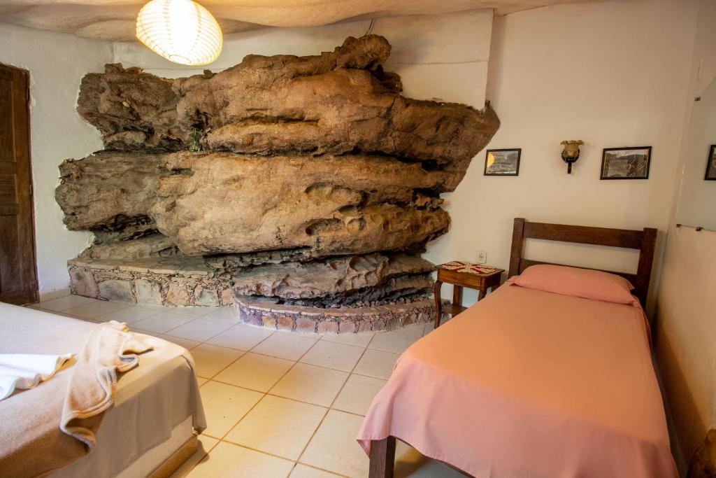 Postel nebo postele na pokoji v ubytování Pousada Flor de Açucena