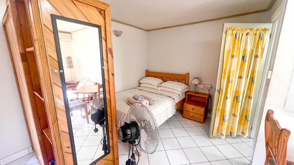 Postel nebo postele na pokoji v ubytování Coco Mango Suites
