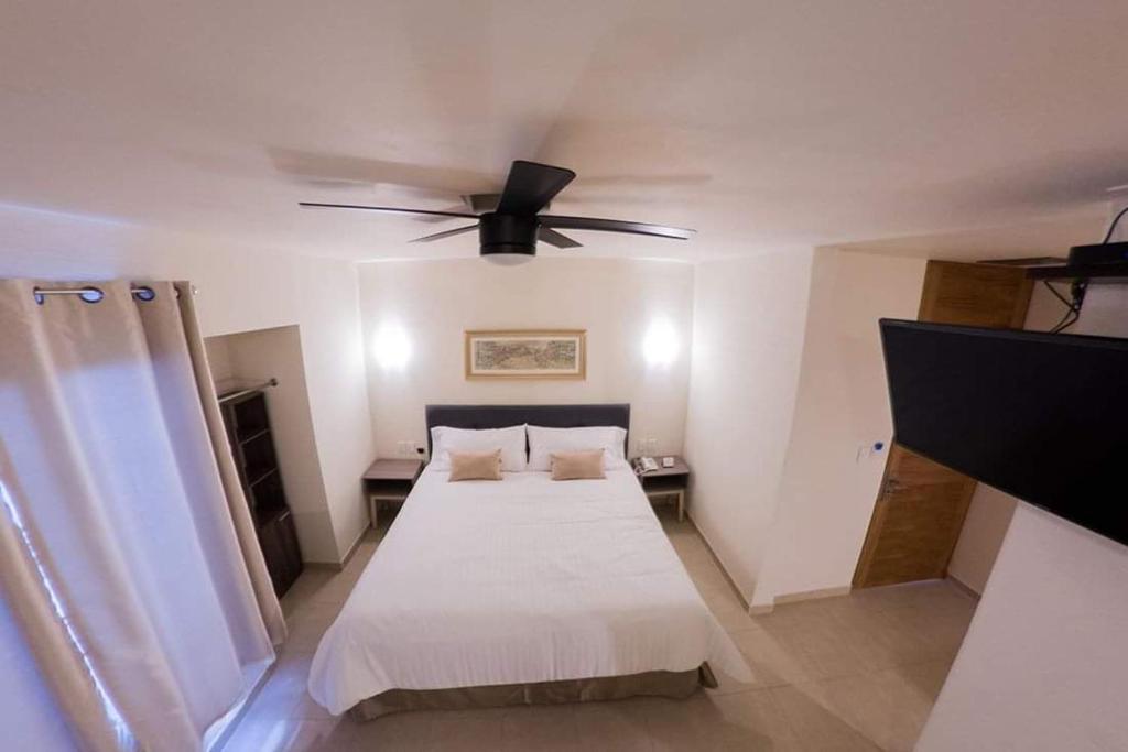 Postel nebo postele na pokoji v ubytování Hotel Siena