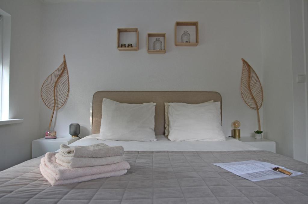 Een bed of bedden in een kamer bij Appartement Mooi Plekje Vlissingen