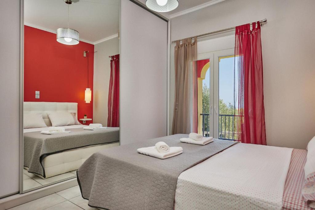 Postel nebo postele na pokoji v ubytování P Koklas Apartments
