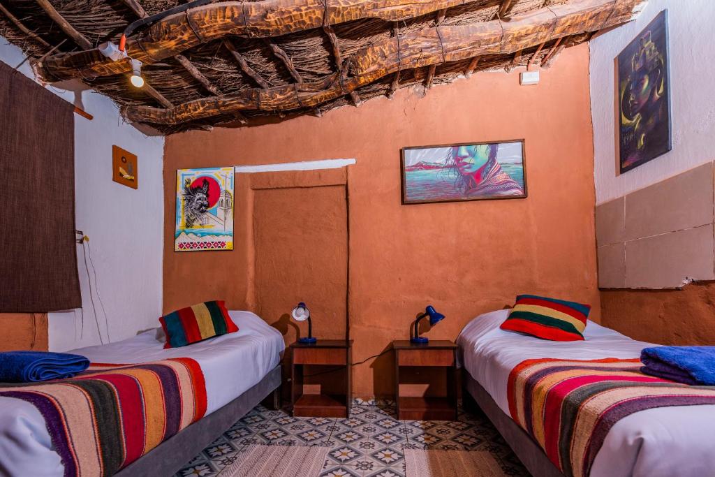 Postel nebo postele na pokoji v ubytování Casa Voyage Hostel