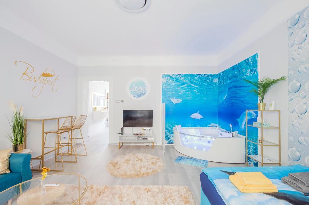 a living room with a blue ocean themed bathroom at AquaFlat Gold in Budapest