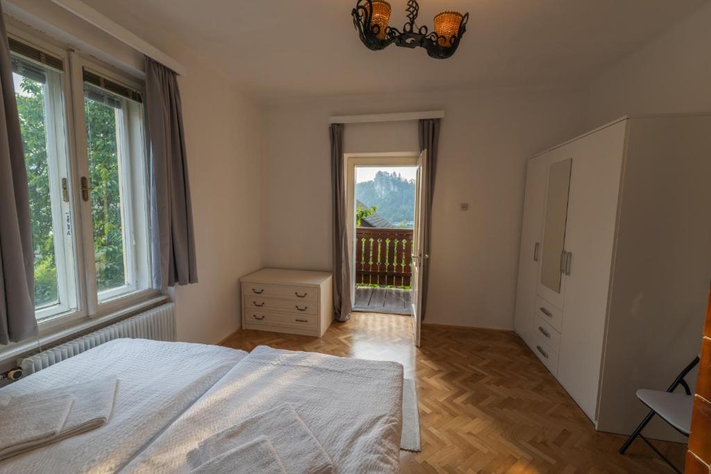a bedroom with a large bed and a window at Villa Anna in Bled