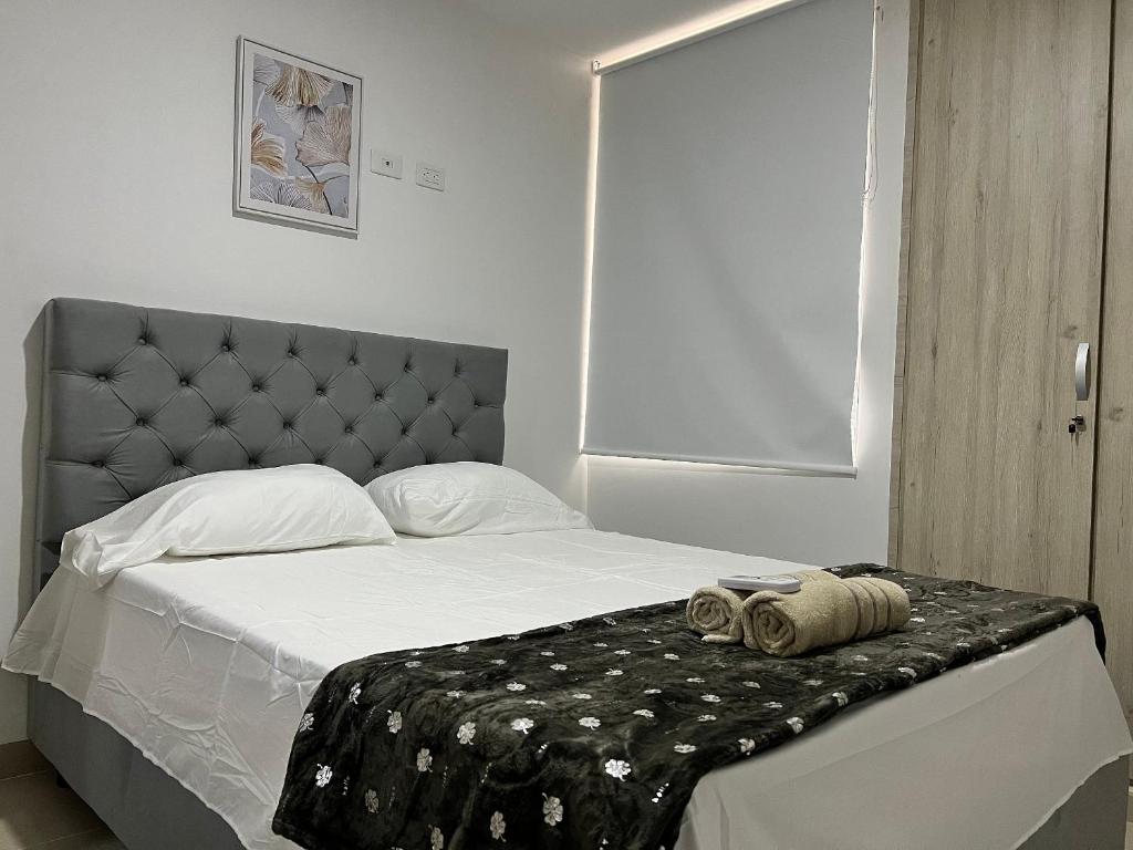 Postel nebo postele na pokoji v ubytování Río Guatapuri y Confort Deluxe