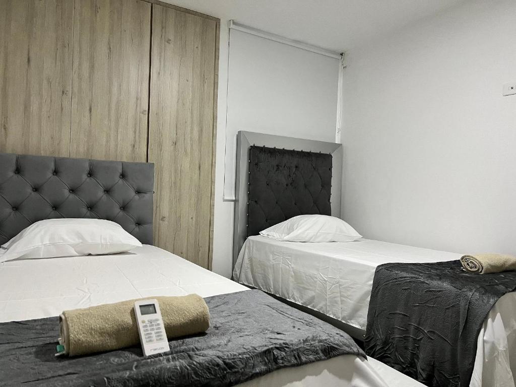 Postel nebo postele na pokoji v ubytování Río Guatapuri y Confort Deluxe