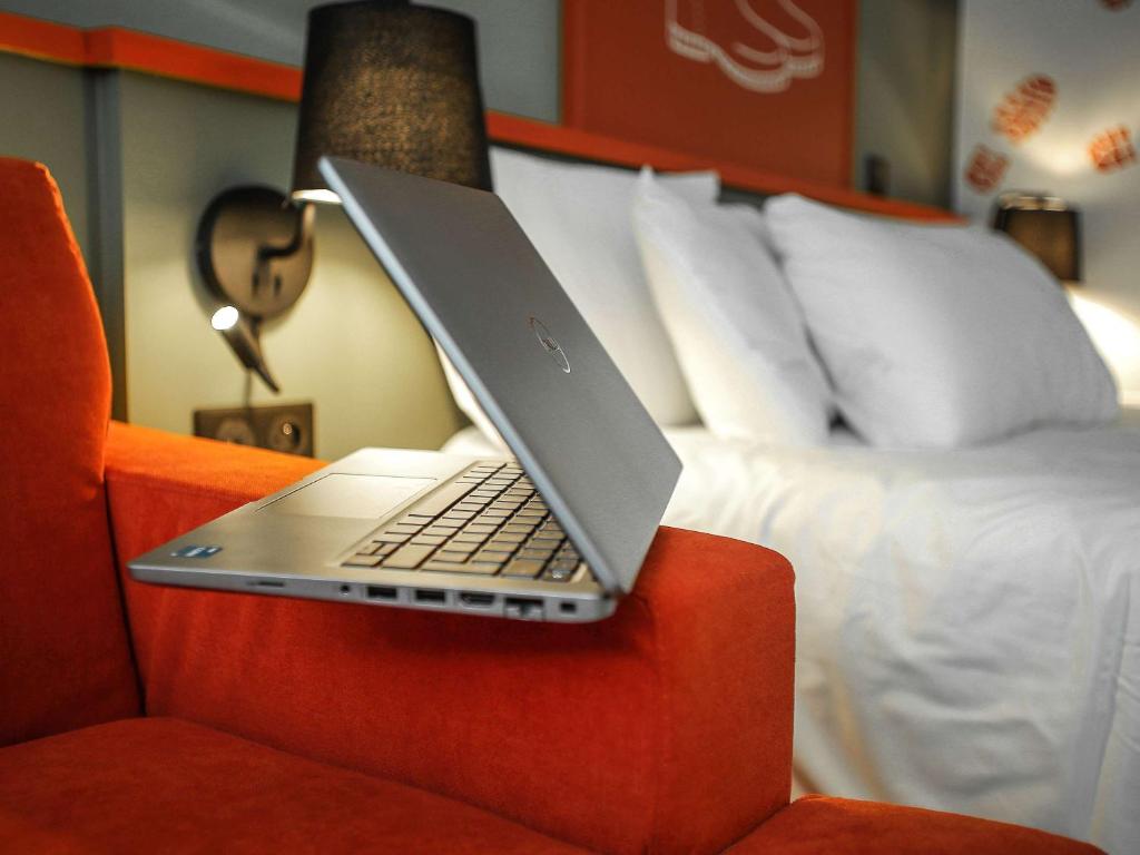 Postel nebo postele na pokoji v ubytování Ibis Styles Lisieux Normandie