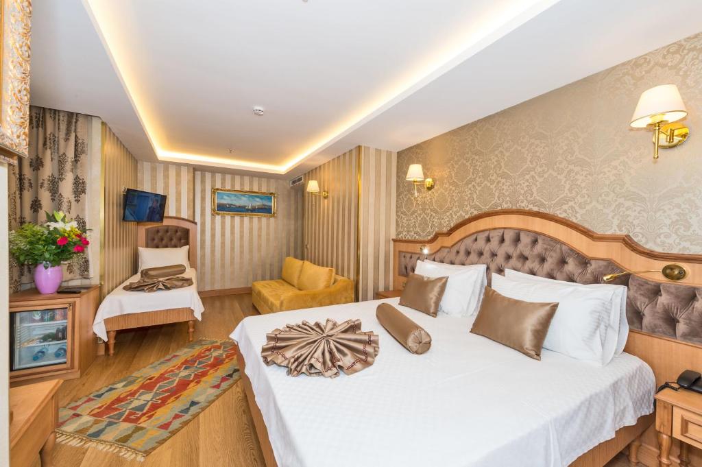 Postel nebo postele na pokoji v ubytování Aprilis Gold Hotel - Special Category