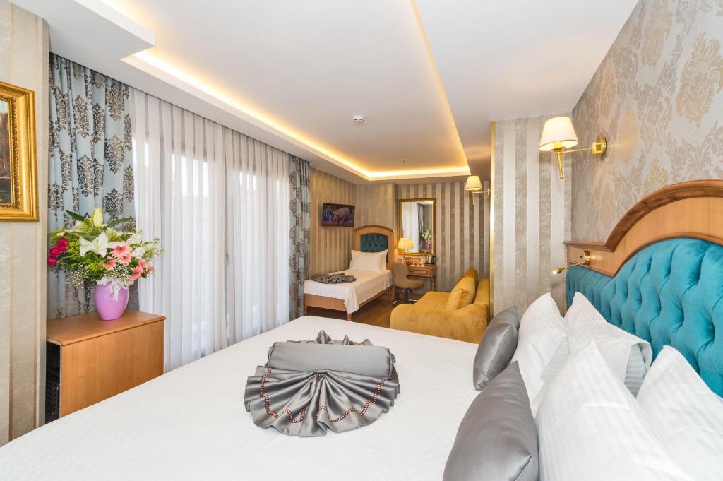Postel nebo postele na pokoji v ubytování Aprilis Gold Hotel - Special Category
