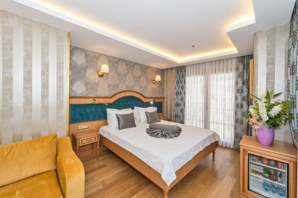 Postel nebo postele na pokoji v ubytování Aprilis Gold Hotel - Special Category