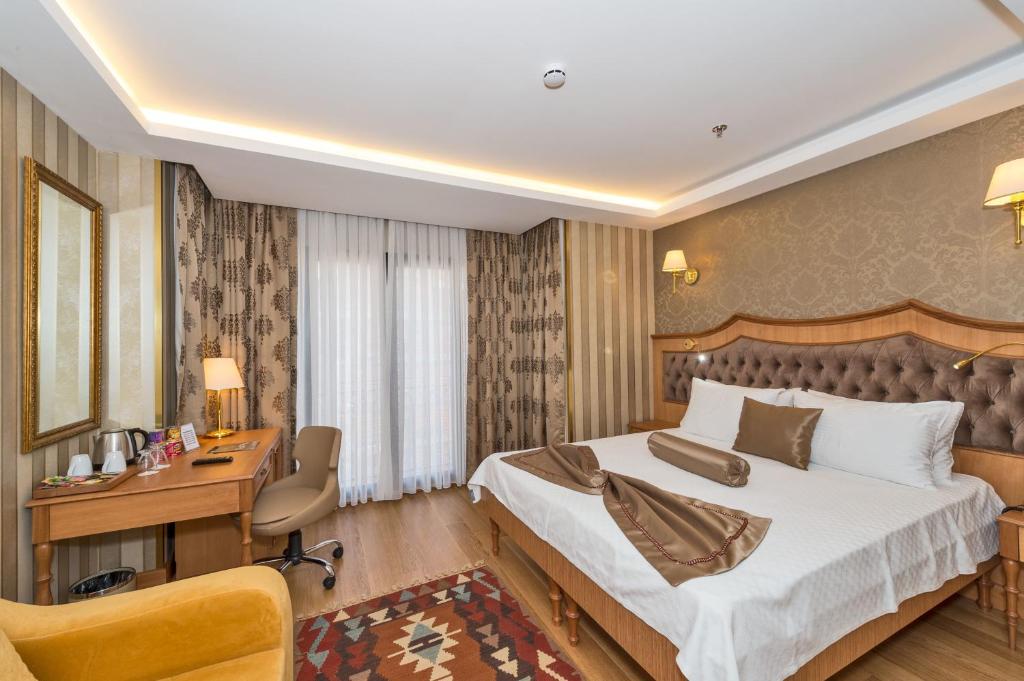 Postel nebo postele na pokoji v ubytování Aprilis Gold Hotel - Special Category