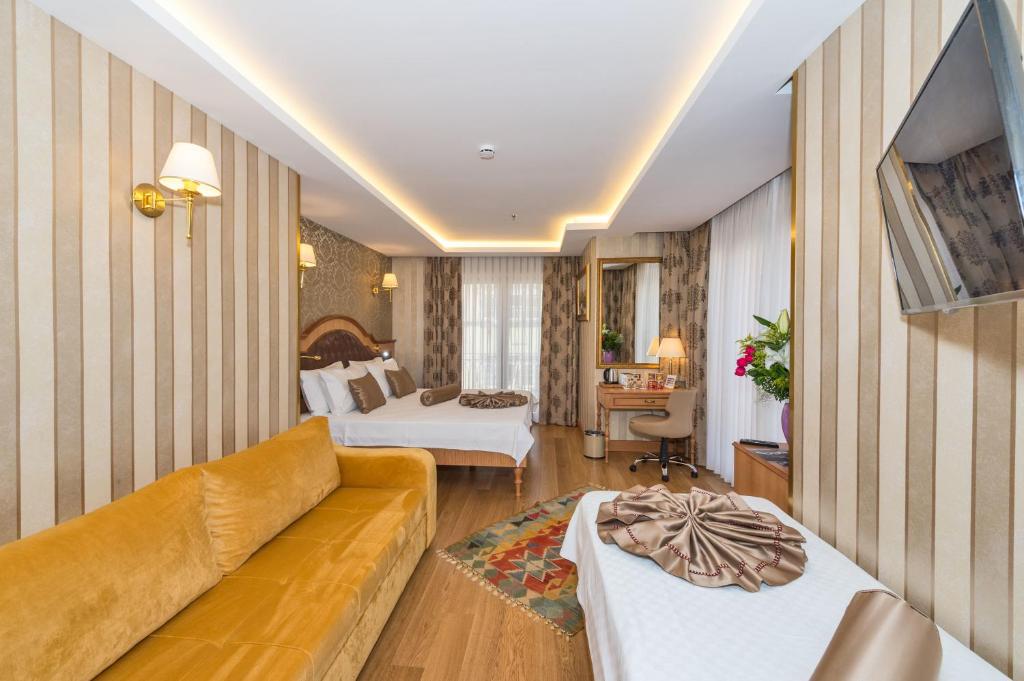 Postel nebo postele na pokoji v ubytování Aprilis Gold Hotel - Special Category