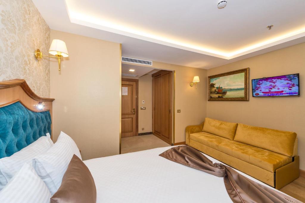 Postel nebo postele na pokoji v ubytování Aprilis Gold Hotel - Special Category