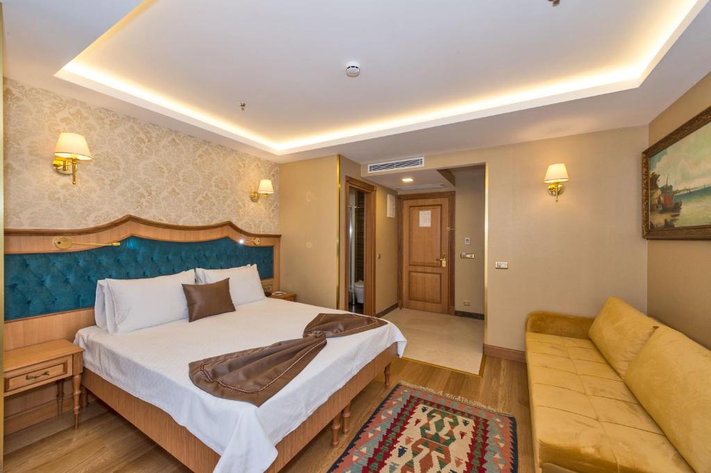 Postel nebo postele na pokoji v ubytování Aprilis Gold Hotel - Special Category