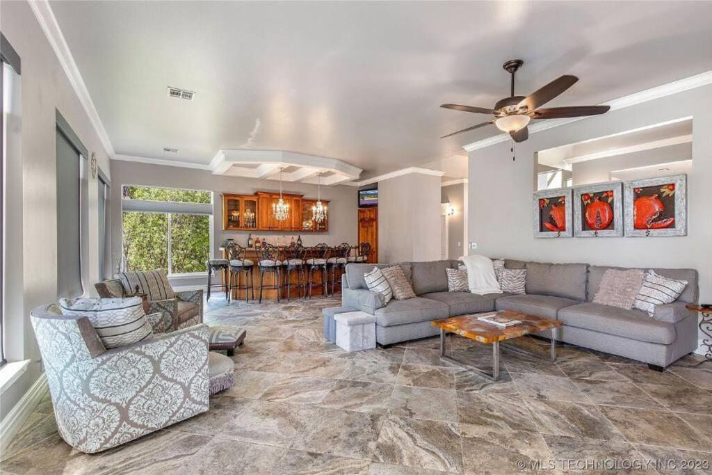 a living room with couches and a dining room at SummerHill Ranch at Grand Lake 8bed/10bath in Grove
