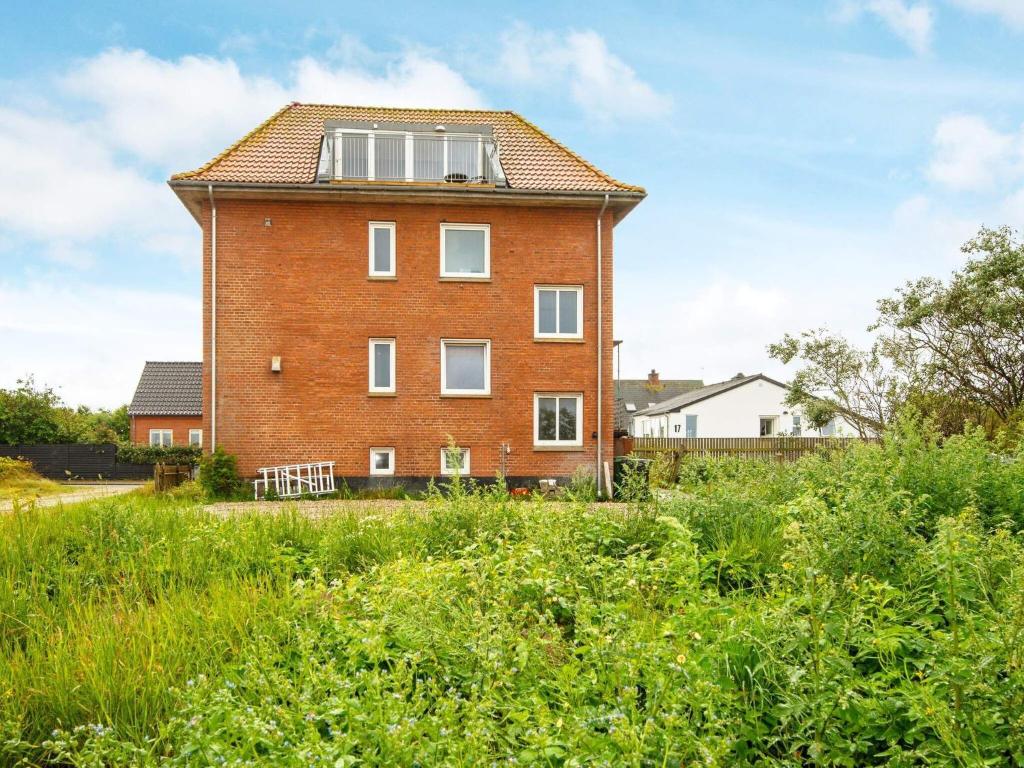 a brick building with a window on top of it at 6 person holiday home in Harboøre-By Traum in Harboør