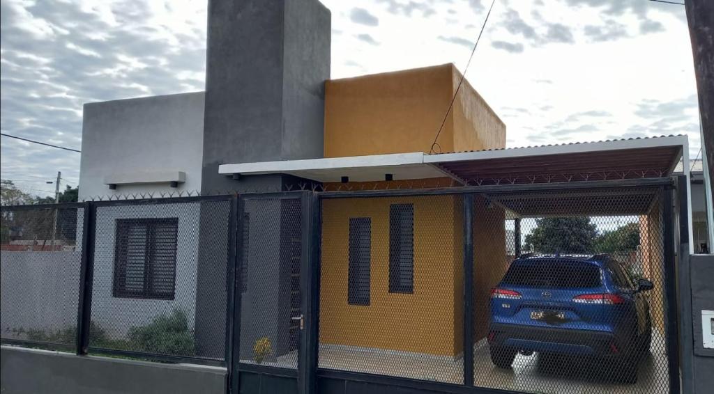a car is parked inside of a building with a garage at Casa Costa Sur in Posadas